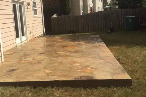 a small wooden structure in a yard