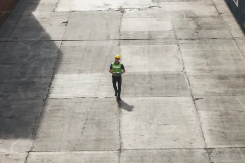a person walking on a paved area