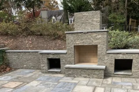 a stone building with a stone patio