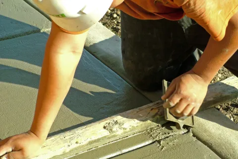a person using a tool to cut a piece of wood