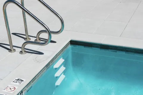 a pool with a pair of glasses