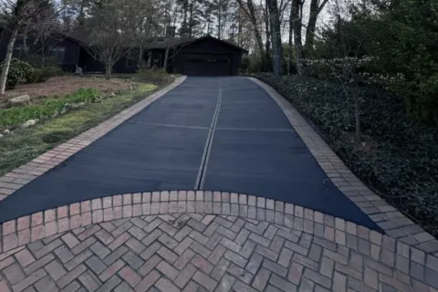 a paved road with trees on either side of it
