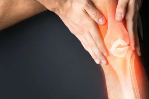 close-up of hands on a knee