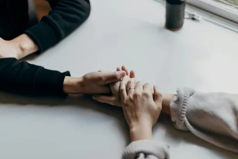close-up of hands on a table