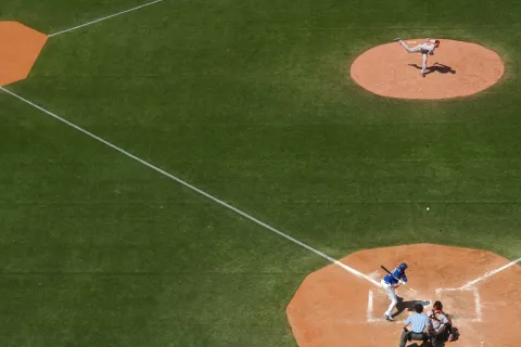 a baseball player throwing a ball