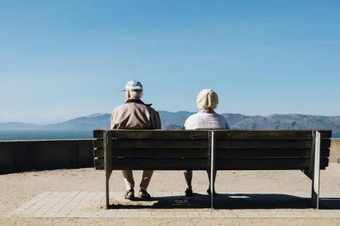 a couple sitting on a bench