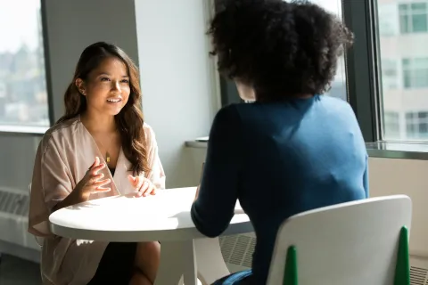 a woman talking to someone
