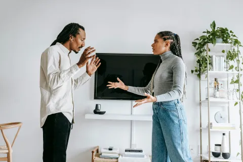 a man and a woman having a passionate conversation
