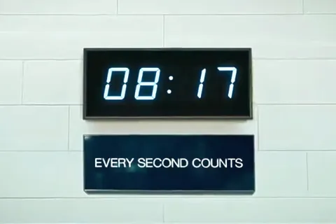 a digital clock on a wall