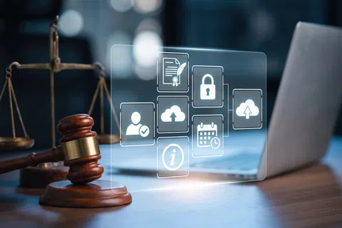 Gavel, scales of justice, laptop, and digital security icons representing legal tech and data protection.
