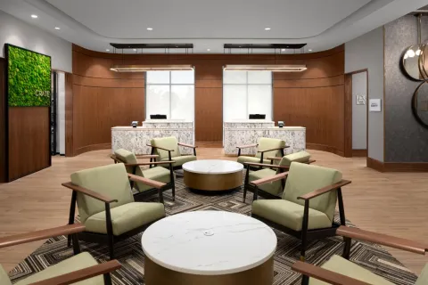 Marriott Courtyard custom lobby front desk millwork and quartz countertops