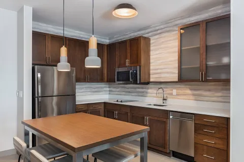 Guestroom kitchen cabinetry and white quartz countertops for Residence Inn by Marriott