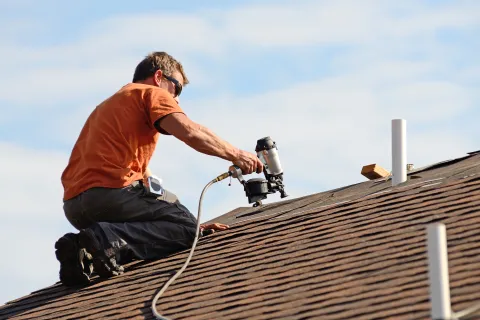 a man on a roof