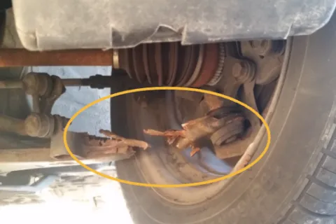a close-up of a snapped control arm