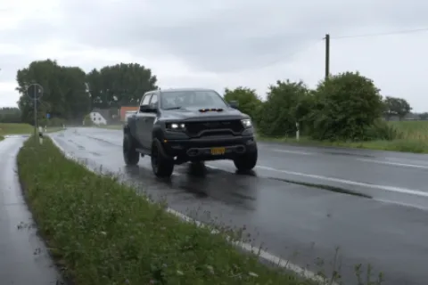 a truck driving on a wet road