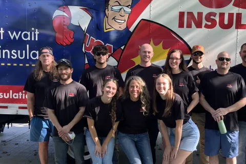 a group of people posing for a photo
