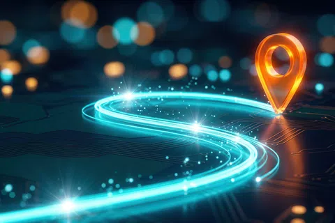 Glowing digital map with a bright orange location pin and a curving neon blue path on a dark circuit board.