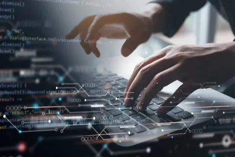 a close-up of hands on a computer