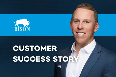 Smiling man in suit with Bison logo and text Customer Success Story on blue background