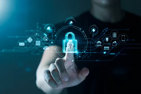 Person touching digital lock icon with cybersecurity and data protection symbols on blue interface.