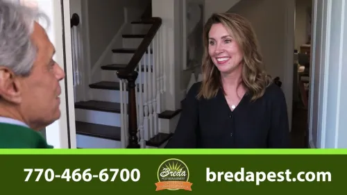 a woman talking to a man