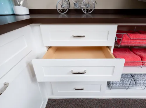 a white sink sitting under a microwave