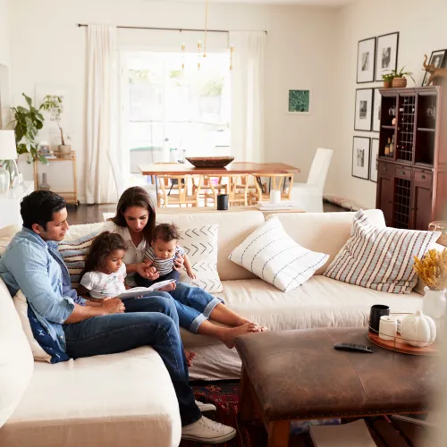 a family sitting on a couch