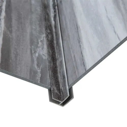 Close-up of gray vinyl flooring panels with a connecting joint for seamless installation on white background