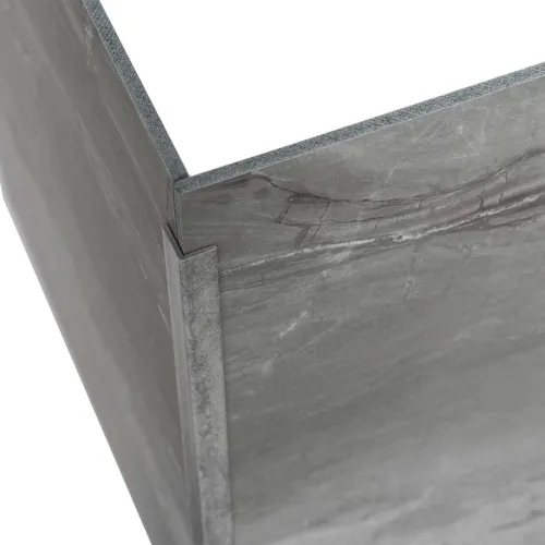 Close-up of a gray stone tile corner detail with a natural textured surface and clean edges