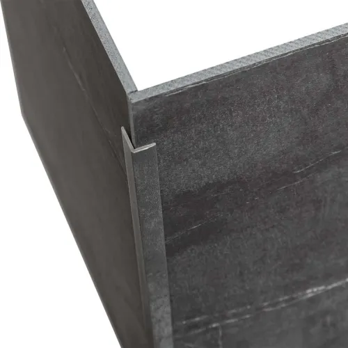 Close-up of a metal corner joint with two dark gray steel panels connected by a metal bracket.