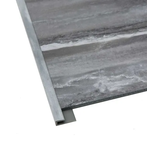 Gray marble tile with metal edge trim on a white background, showing corner detail and texture.