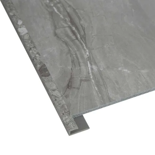 Gray marble-effect tile with L-shaped metal trim for edge protection and stylish finish.