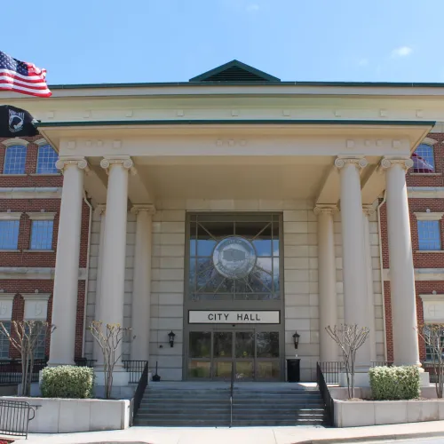 a building with columns and a flag