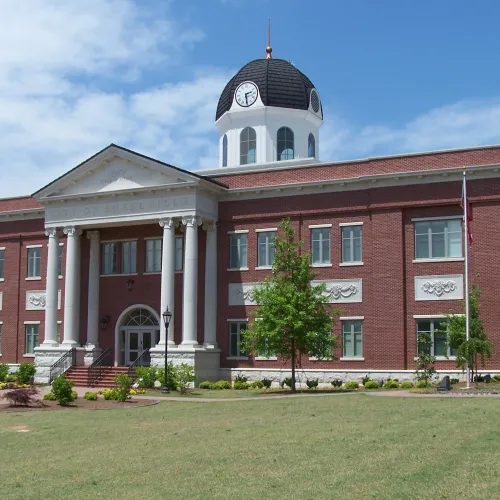 a large brick building with a clock tower