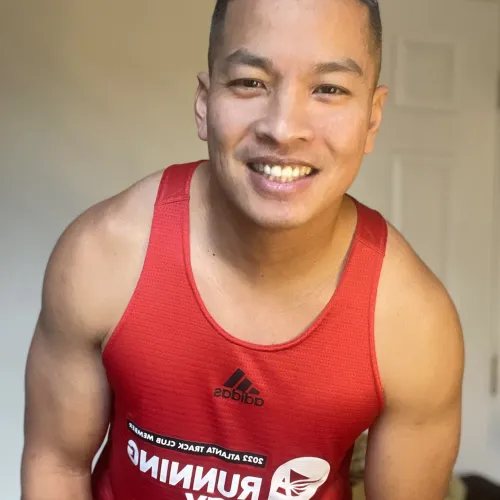 a person wearing a red tank top