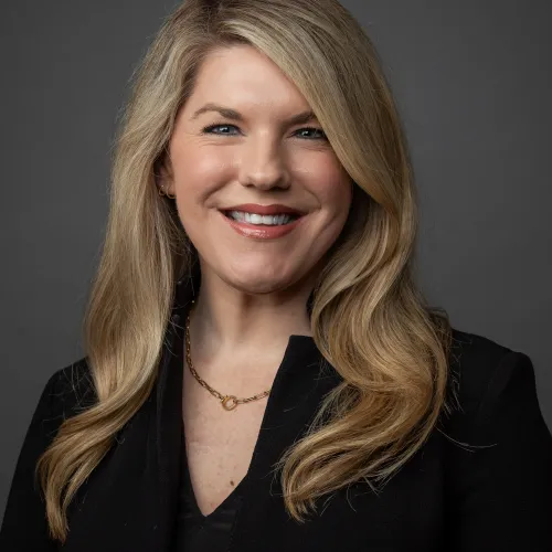 a woman with long hair smiling