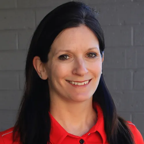 a woman smiling for the camera