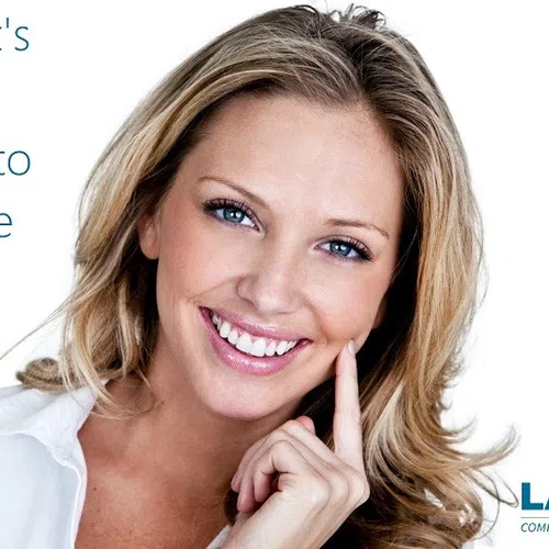 Smiling woman with white teeth promoting dental care and a fashion quote about wearing a white smile after Labor Day.