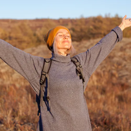 a woman with her arms raised