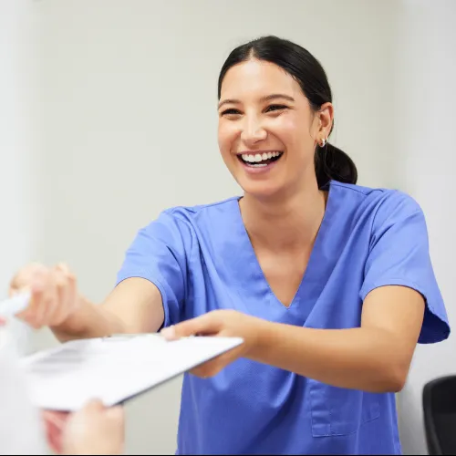 a woman holding a piece of paper