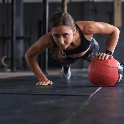 a person lifting a ball