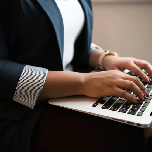 a person typing on a laptop
