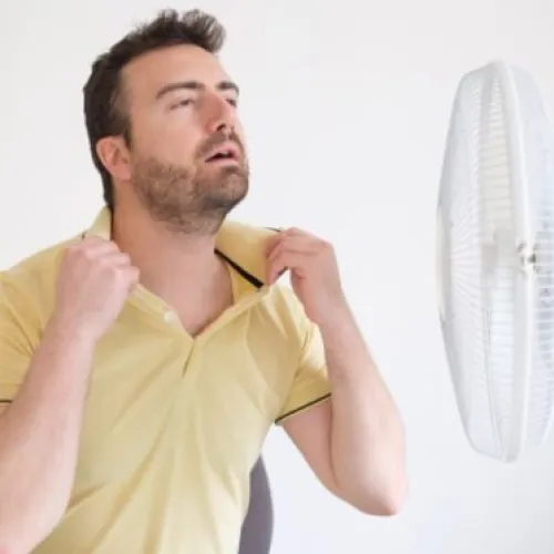 Uncomfortable man who needs a dehumidifier