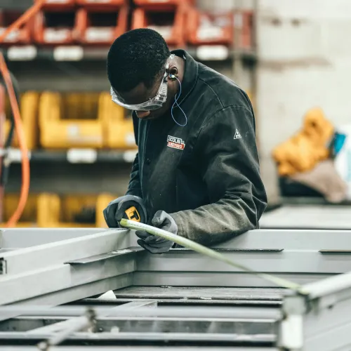 Reid Workplace Wellness showing an employee working in a factory