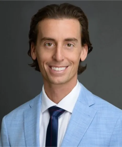 a man wearing a blue shirt and a tie