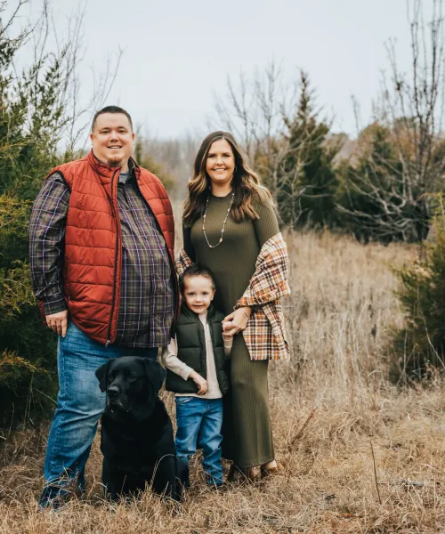 a family standing in a field