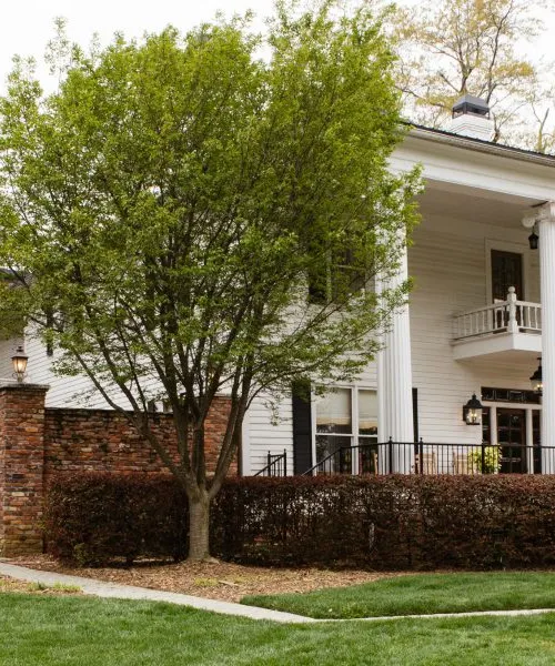 a white house with pillars