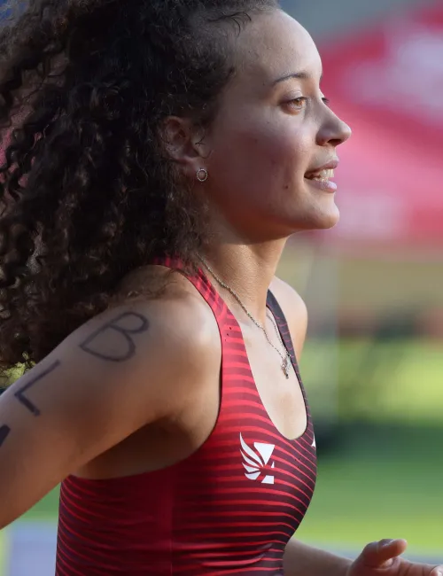 a woman running on a track