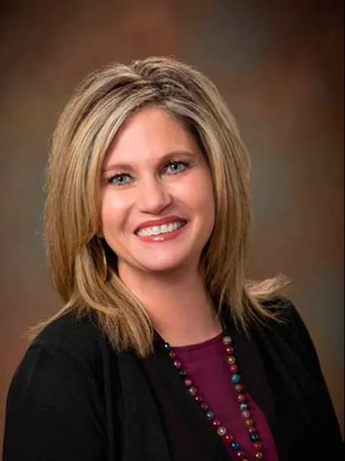a woman smiling for the camera