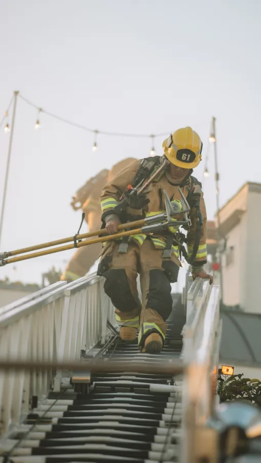 a firefighter on a ladder